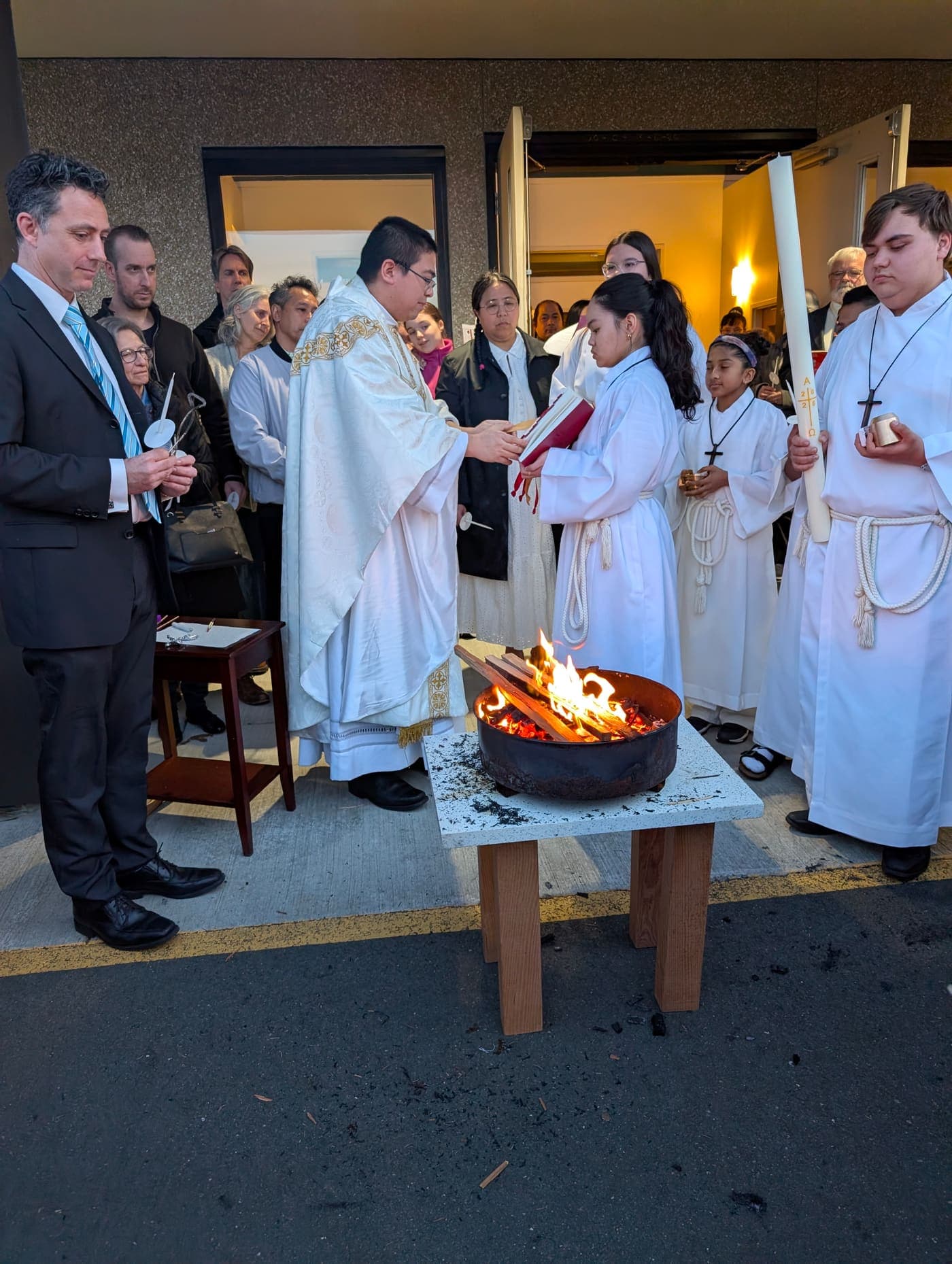 The parish gathered outdoors around the new fire at the start of the Easter Vigil