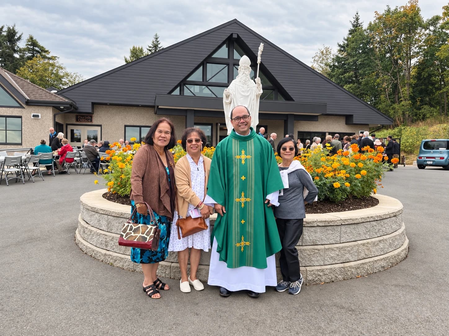 Father Mel and parishioners gathered outside the church during a community barbecue